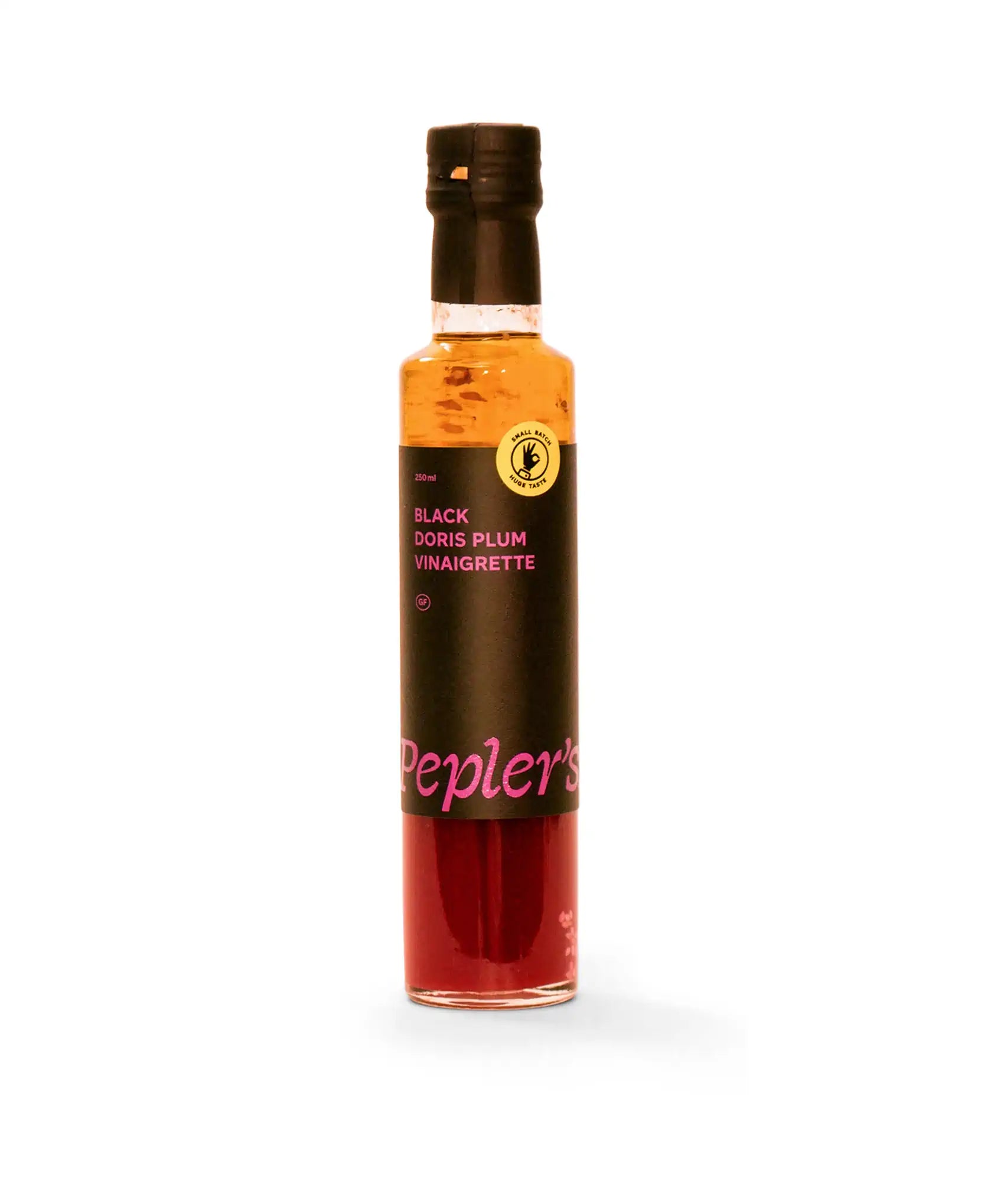 A bottle of Pepler's Black Doris Plum Vinaigrette, featuring a sleek design with a dark label and vibrant pink text. The label indicates a volume of 250ml and includes a badge that reads "Small Batch Huge Taste." The vinaigrette has a rich, red hue visible through the transparent glass, set against a plain white background.