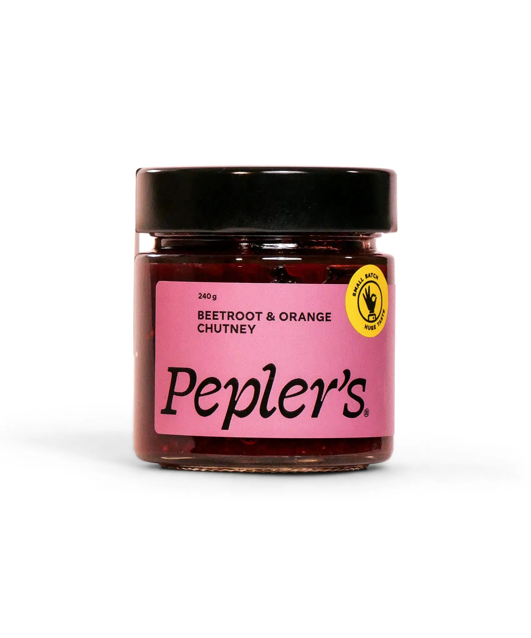 A jar of Pepler's Beetroot and Orange Chutney, featuring a vibrant pink label that prominently displays the product name and weight (240g). The jar is sealed with a black lid and includes a yellow badge indicating it's a small batch product. The background is plain white, emphasising the chutney's appealing packaging.