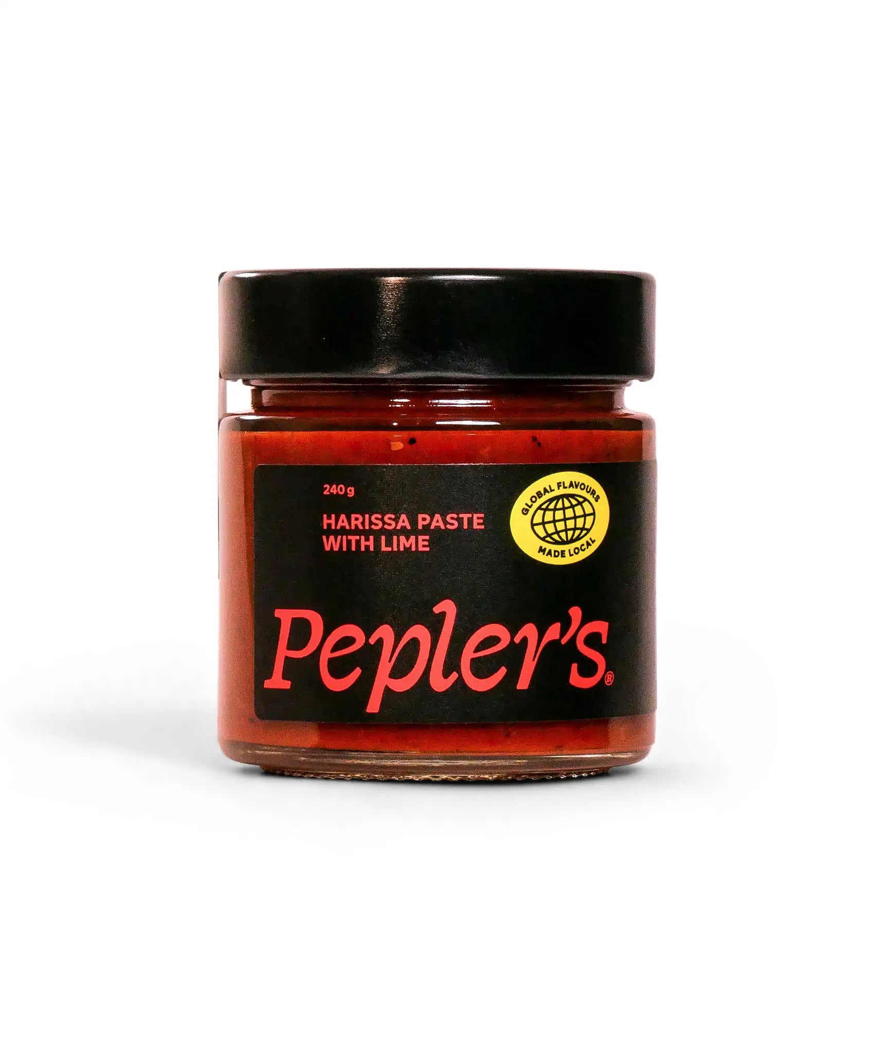 A glass jar containing Pepler's harissa paste with lime, featuring a black lid and a bold label. The label displays the product name in large red letters, along with a round logo indicating "global flavours made local." The jar holds 240 grams of the spicy condiment, set against a white background.