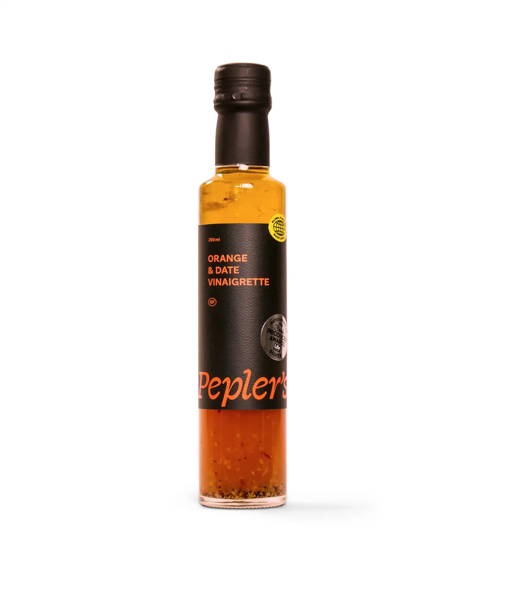 A bottle of Pepler's Orange & Date Vinaigrette sits against a plain white background. The bottle is glass with a black cap and features a label detailing its contents. The main label highlights "Orange & Date Vinaigrette" in bold orange text, with additional information indicating a volume of 250 ml and a gluten-free certification. A silver award sticker is visible on the bottle, showcasing recognition for outstanding products. The vinaigrette has a rich, amber hue, with visible specks of herbs and spices.