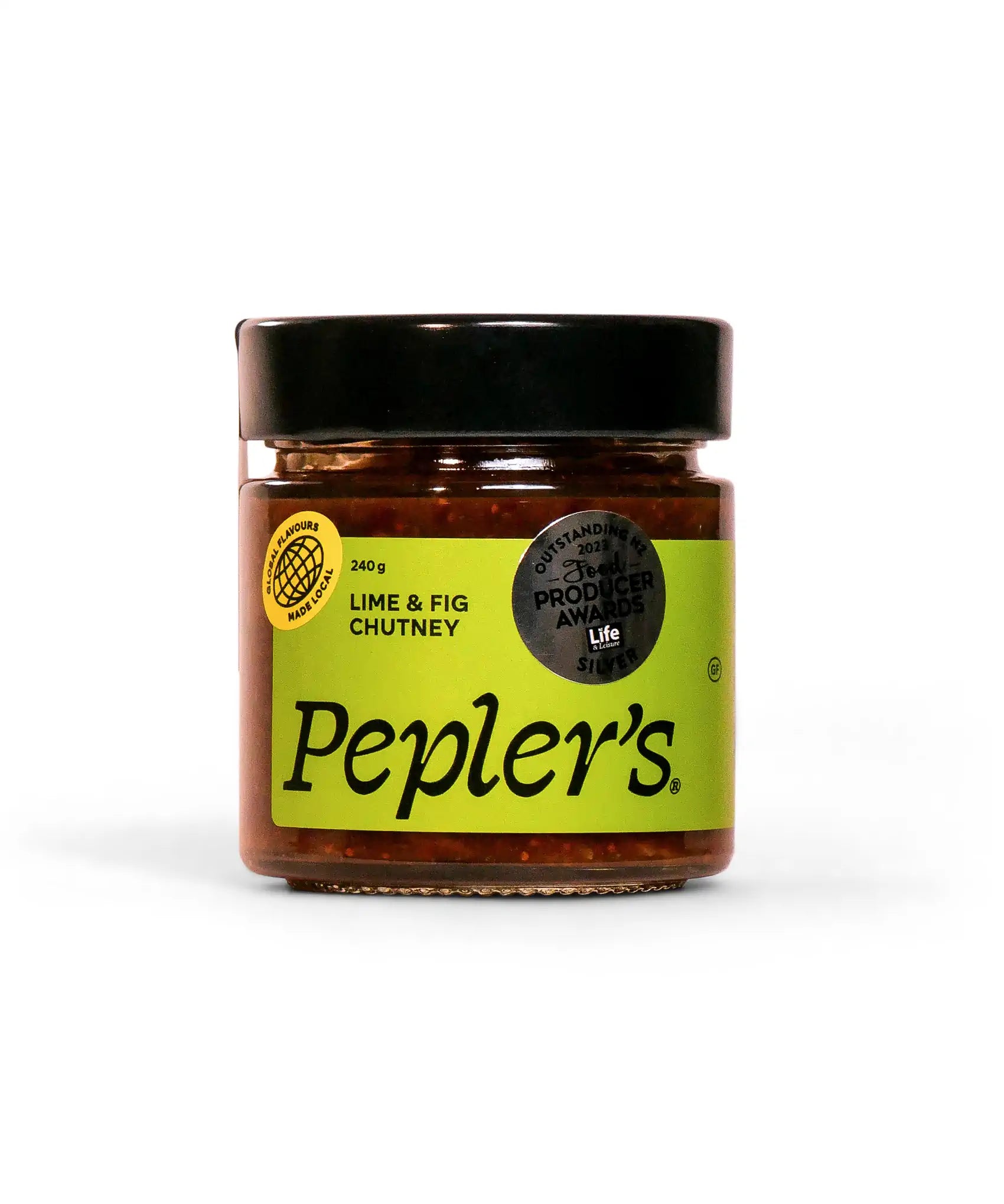 A clear jar of Pepler's Lime & Fig Chutney, weighing 240 grams, prominently displayed with a bright green label. The label features bold black text and a logo indicating an award for outstanding produce from 2021. The product has a black lid and is set against a light background, highlighting its contents.